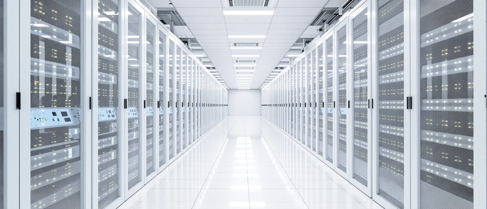 A bright white data center aisle lined with glass-front server racks